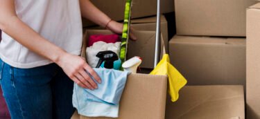 crop-woman-packing-boxes